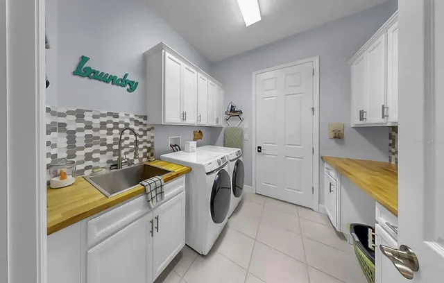 a bathroom with a granite countertop sink a toilet a mirror a vanity and shower