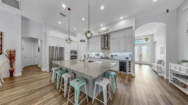 a kitchen with white cabinets and white appliances