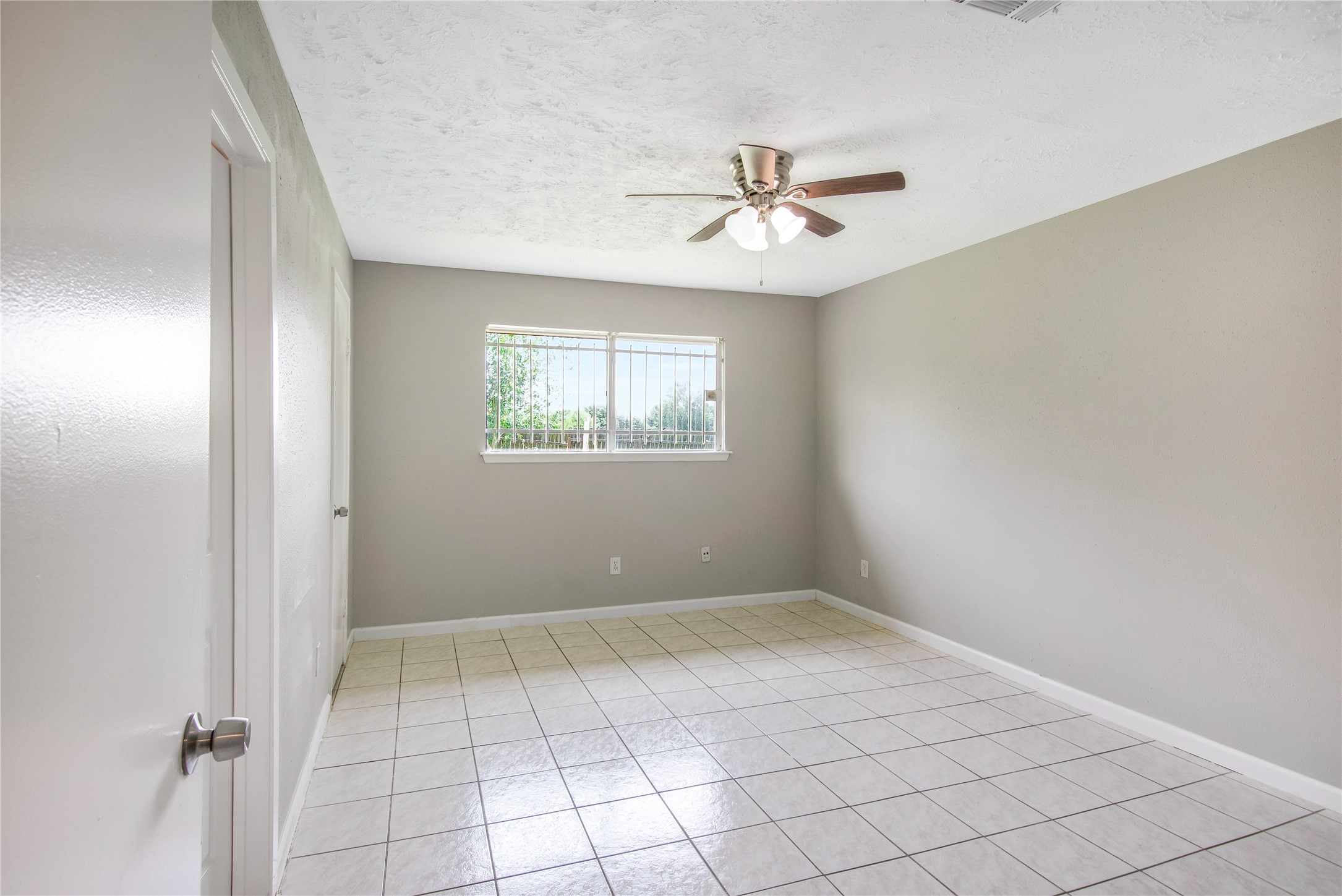 11710 Old Telegraph Road Houston, TX 77067 - Photo 18 of 24 Large primary bedroom with ceiling fan, two closets and one is walk-in!