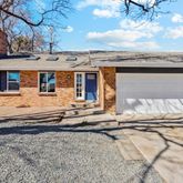 a view of a house with a snow on the road
