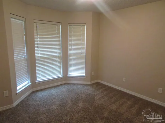 a view of a room that has a window in it