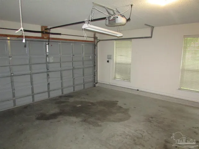 a view of a house with a backyard and deck