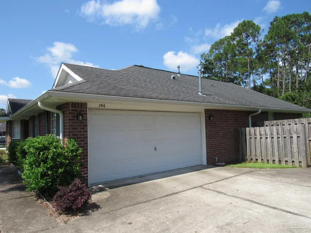 a front view of a house with a garage