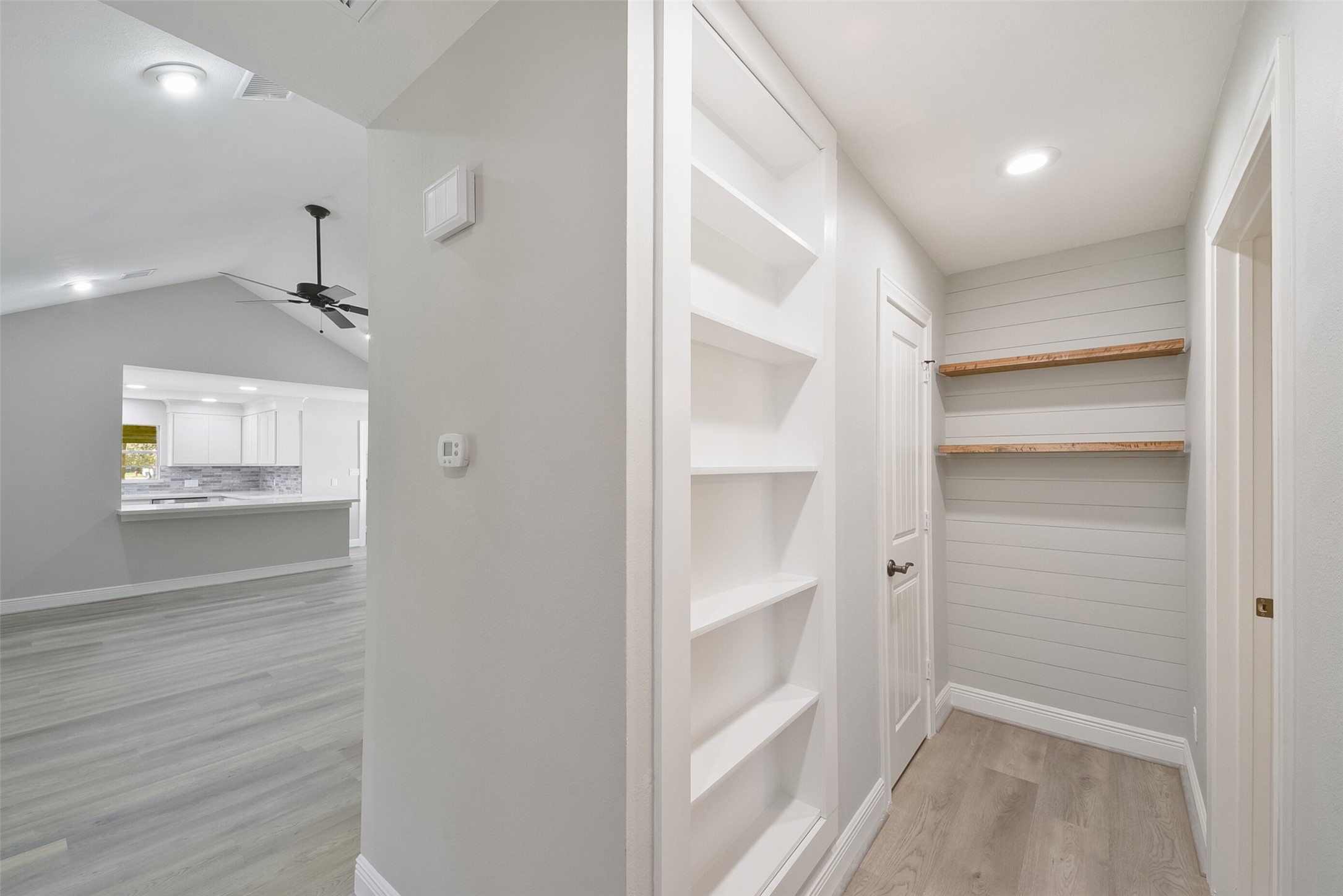 2915 Katy Hockley Road Katy, TX 77493 - Photo 28 of 50 View of hall way, the shelves to the left, is actually a door to a hidden closet. The next door is a very large cedar closet.