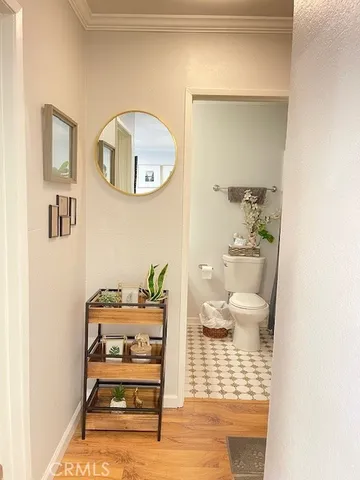 a bathroom with a sink toilet and a mirror