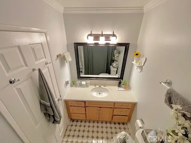 a bathroom with a sink a mirror and vanity