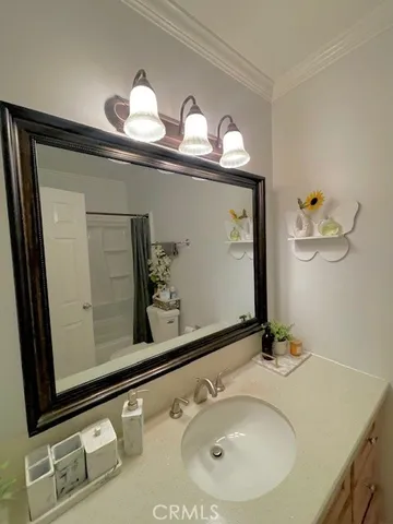 a bathroom with a sink and mirror