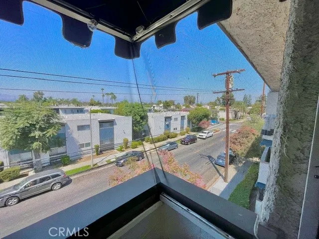 a view of a kitchen with kitchen island and a stove