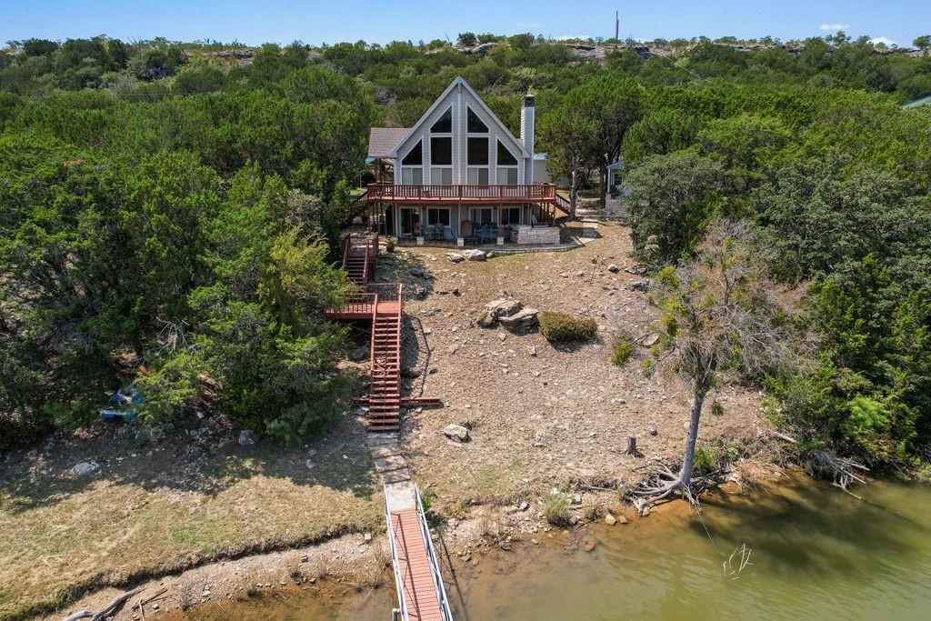 an aerial view of a house with a yard