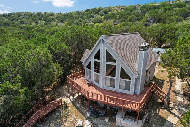 aerial view of a house with a roof deck