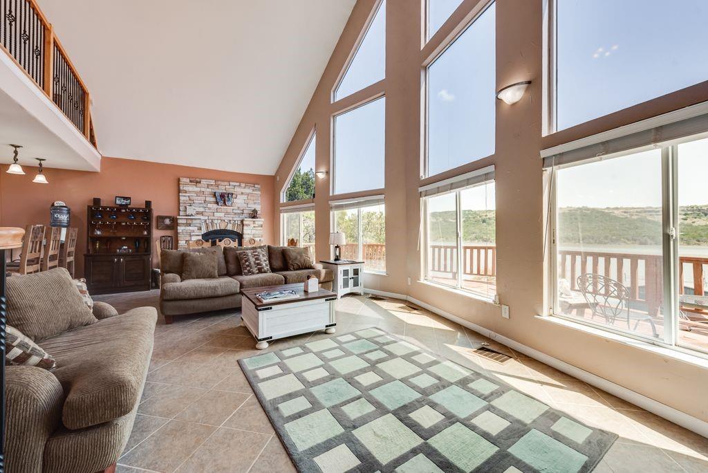 3617 Brandy Road Caddo, TX 76429 - Photo 5 of 40 Living room with high vaulted ceiling, and a stone fireplace