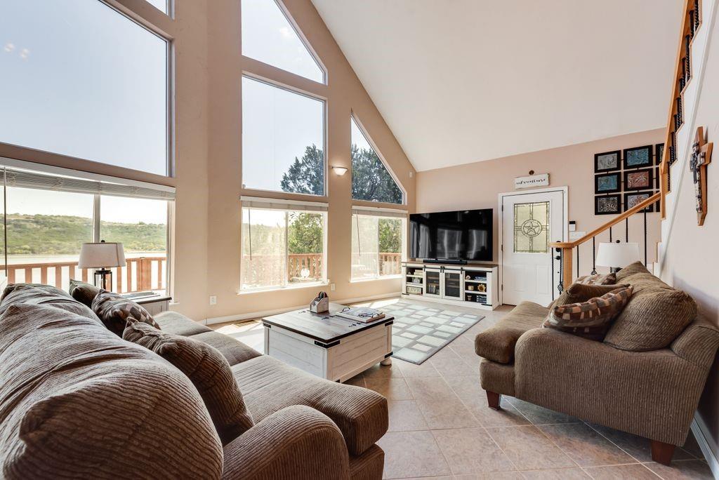 3617 Brandy Road Caddo, TX 76429 - Photo 7 of 40 Living room featuring high vaulted ceiling with beautiful view of the lake.