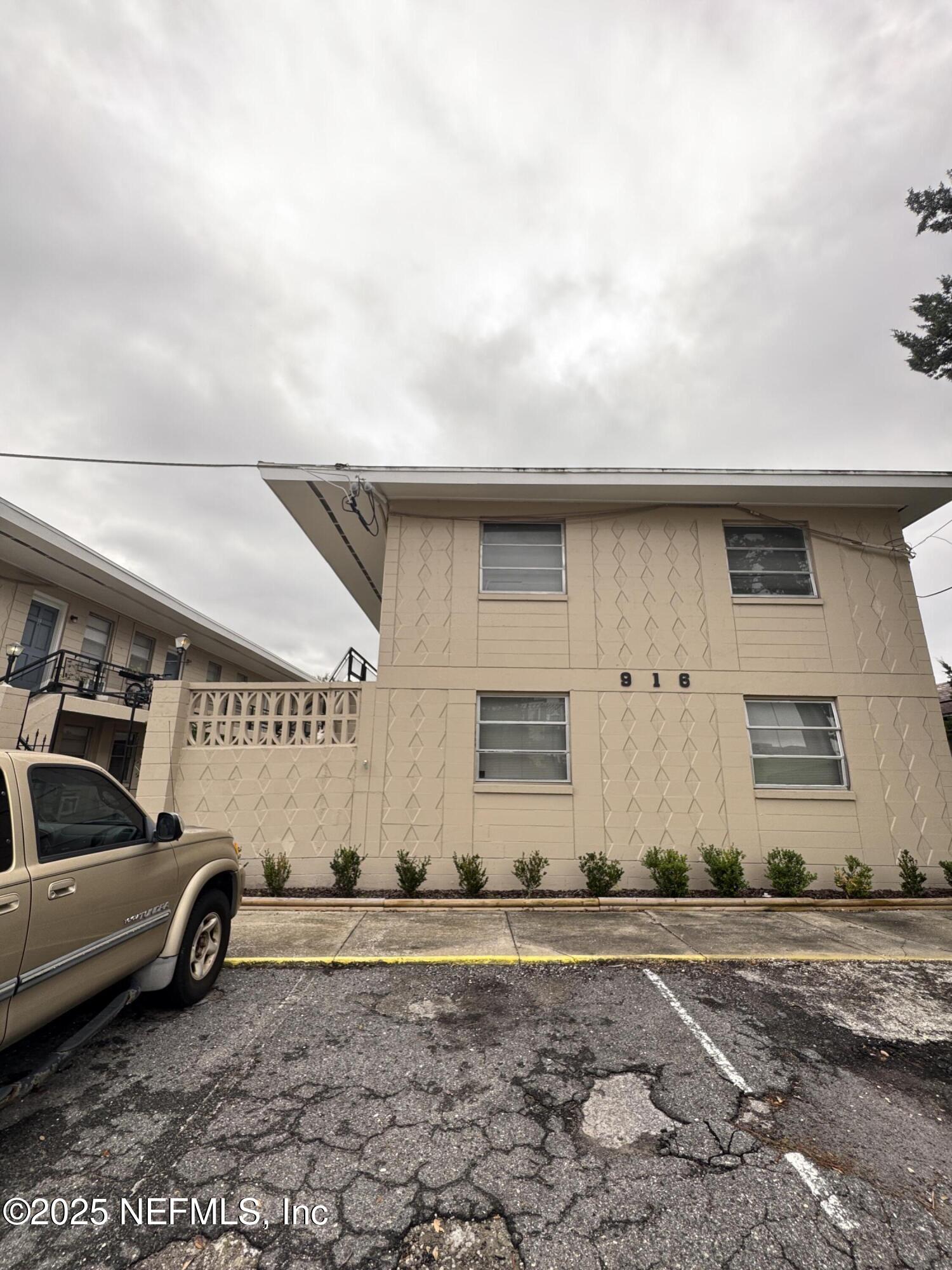 916 Childrens Way, Unit 4 Jacksonville, FL 32207 - Photo 9 of 9 a view of a car park in front of house