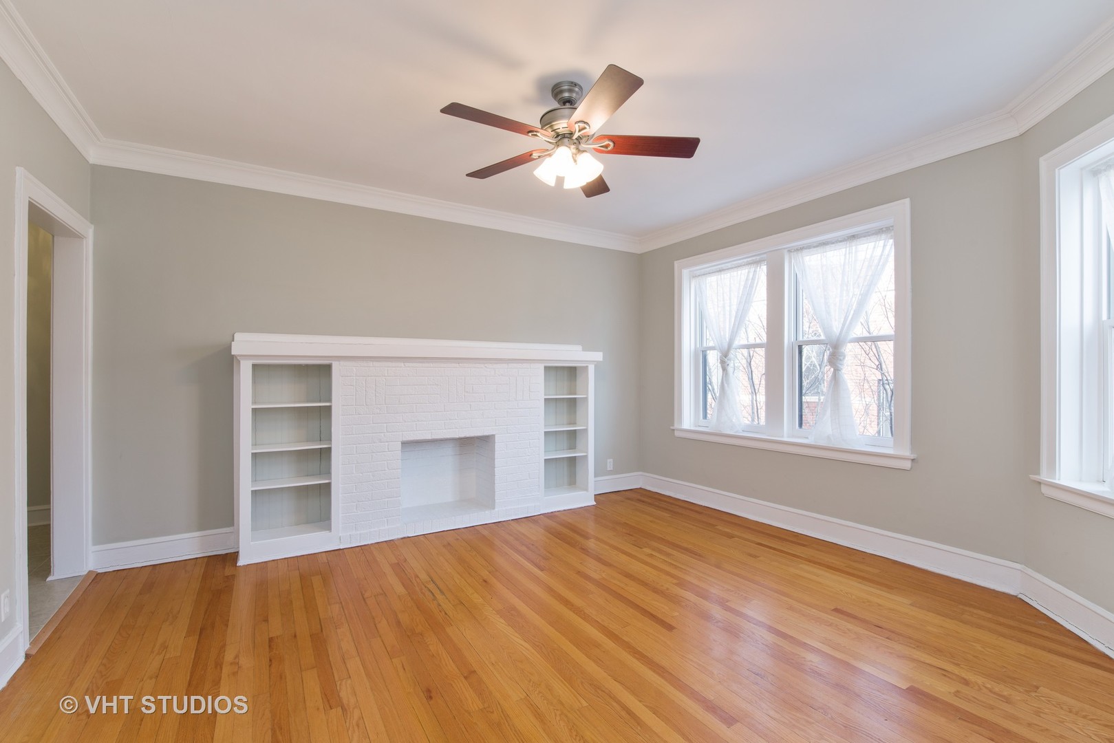 528 Sheridan Road, Unit 3A Evanston, IL 60202 - Photo 3 of 11 a view of an empty room with a fireplace and a window