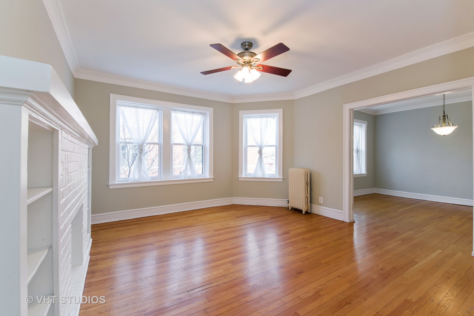 528 Sheridan Road, Unit 3A Evanston, IL 60202 - Photo 4 of 11 a view of an empty room with wooden floor and a window