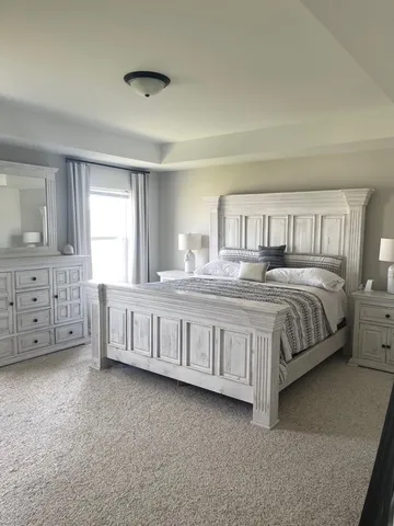a spacious bathroom with a double vanity sink and a mirror