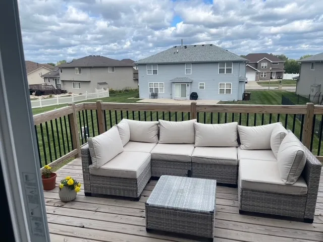 a view of a balcony with furniture