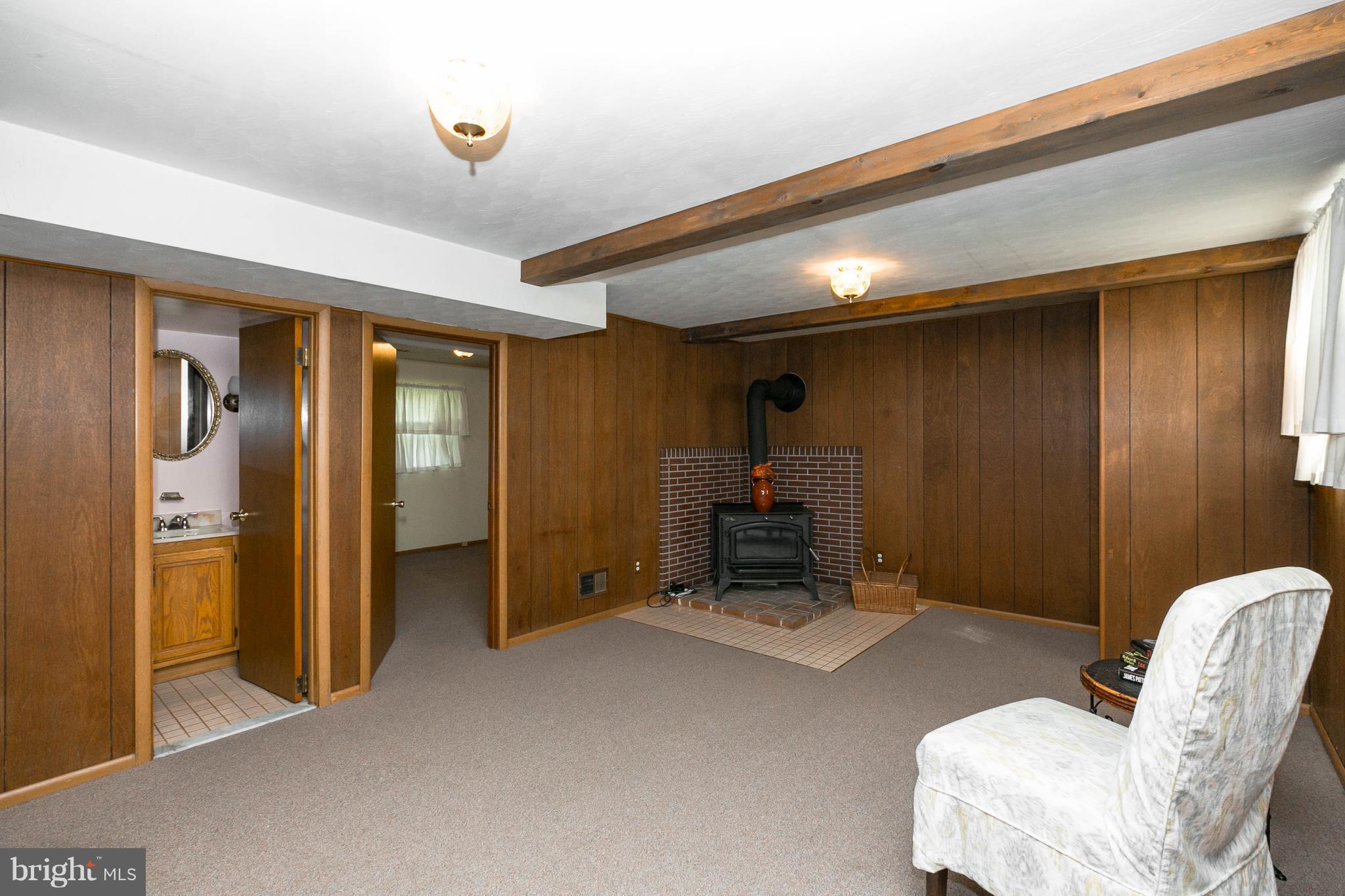 502 Bathurst Road Baltimore, MD 21228 - Photo 12 of 23 Finished part of LL w/ wood burning stove