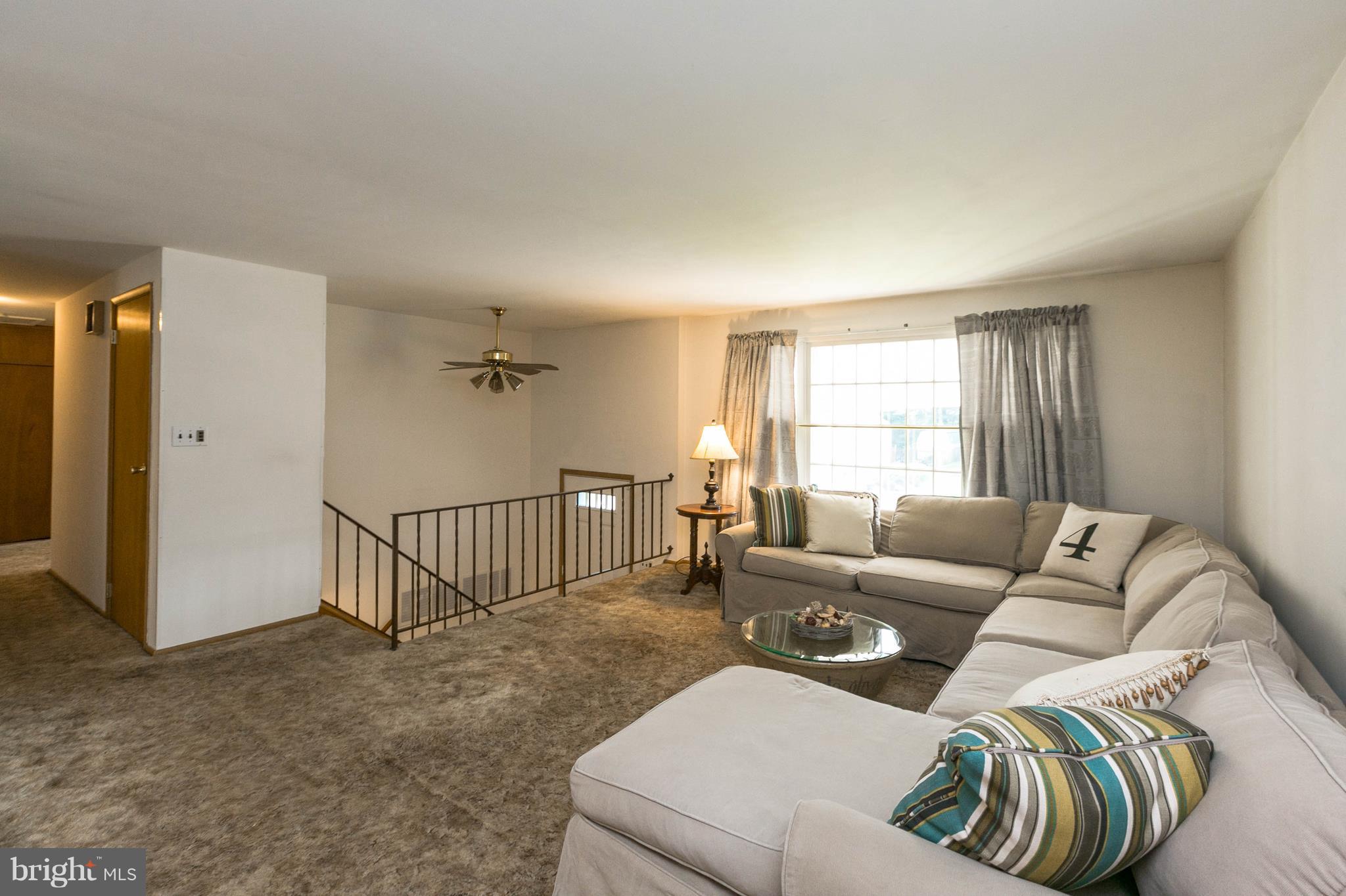 502 Bathurst Road Baltimore, MD 21228 - Photo 3 of 23 SPACIOUS living room -hardwood under carpet
