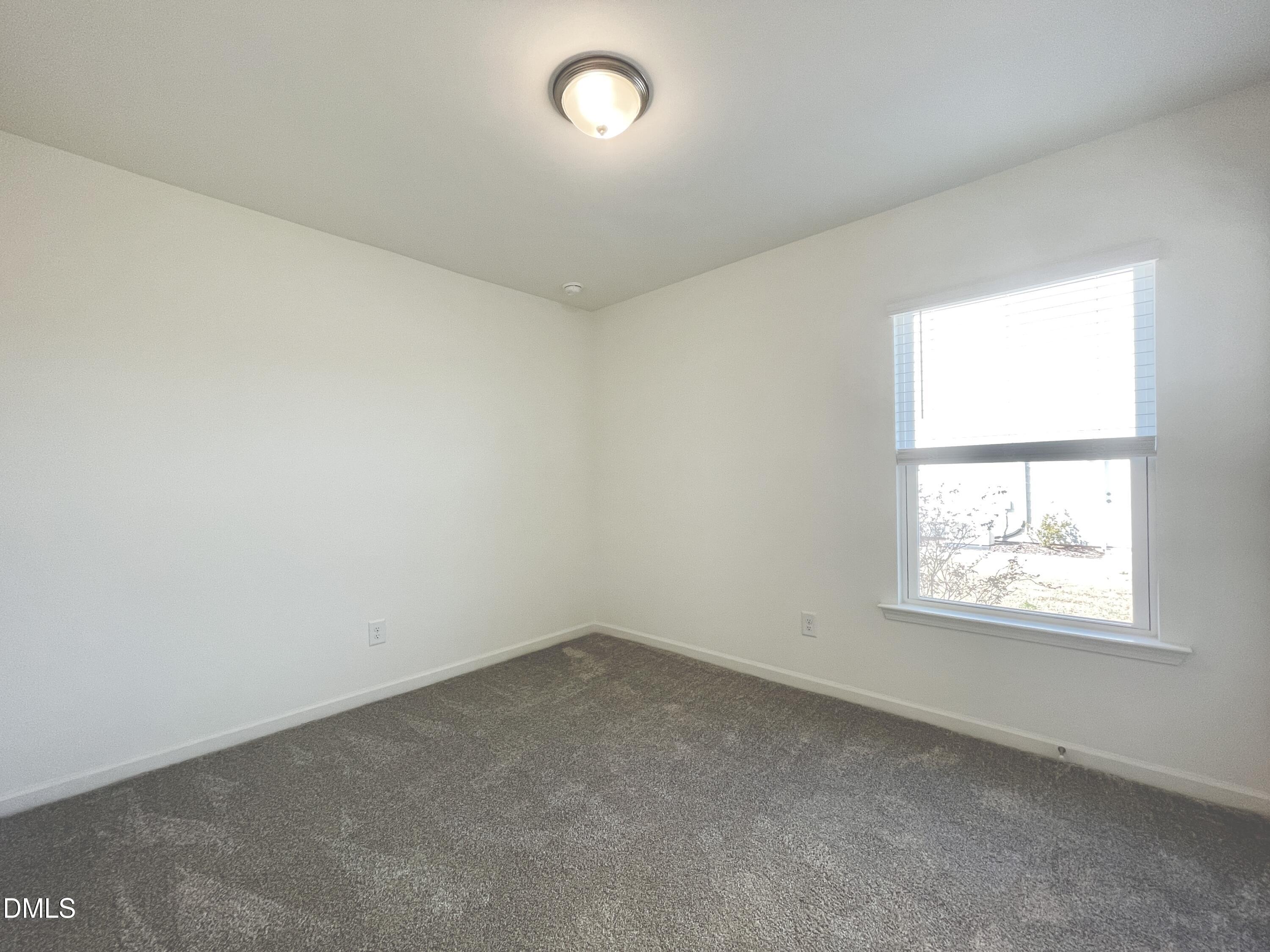 6117 Oak Psge Drive Raleigh, NC 27603 - Photo 17 of 25 an empty room with a window