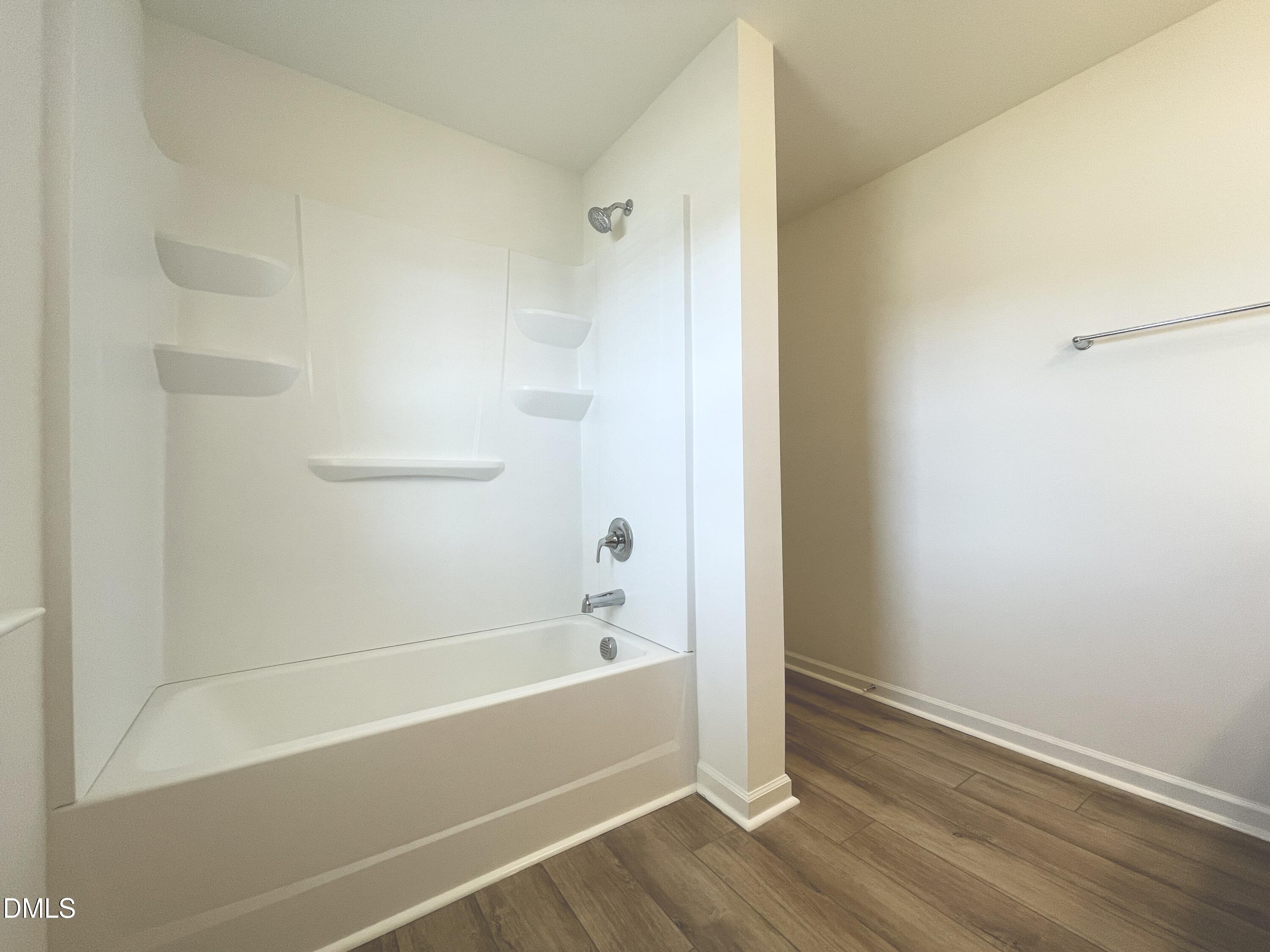 6117 Oak Psge Drive Raleigh, NC 27603 - Photo 20 of 25 a bathroom with a bathtub and a shower