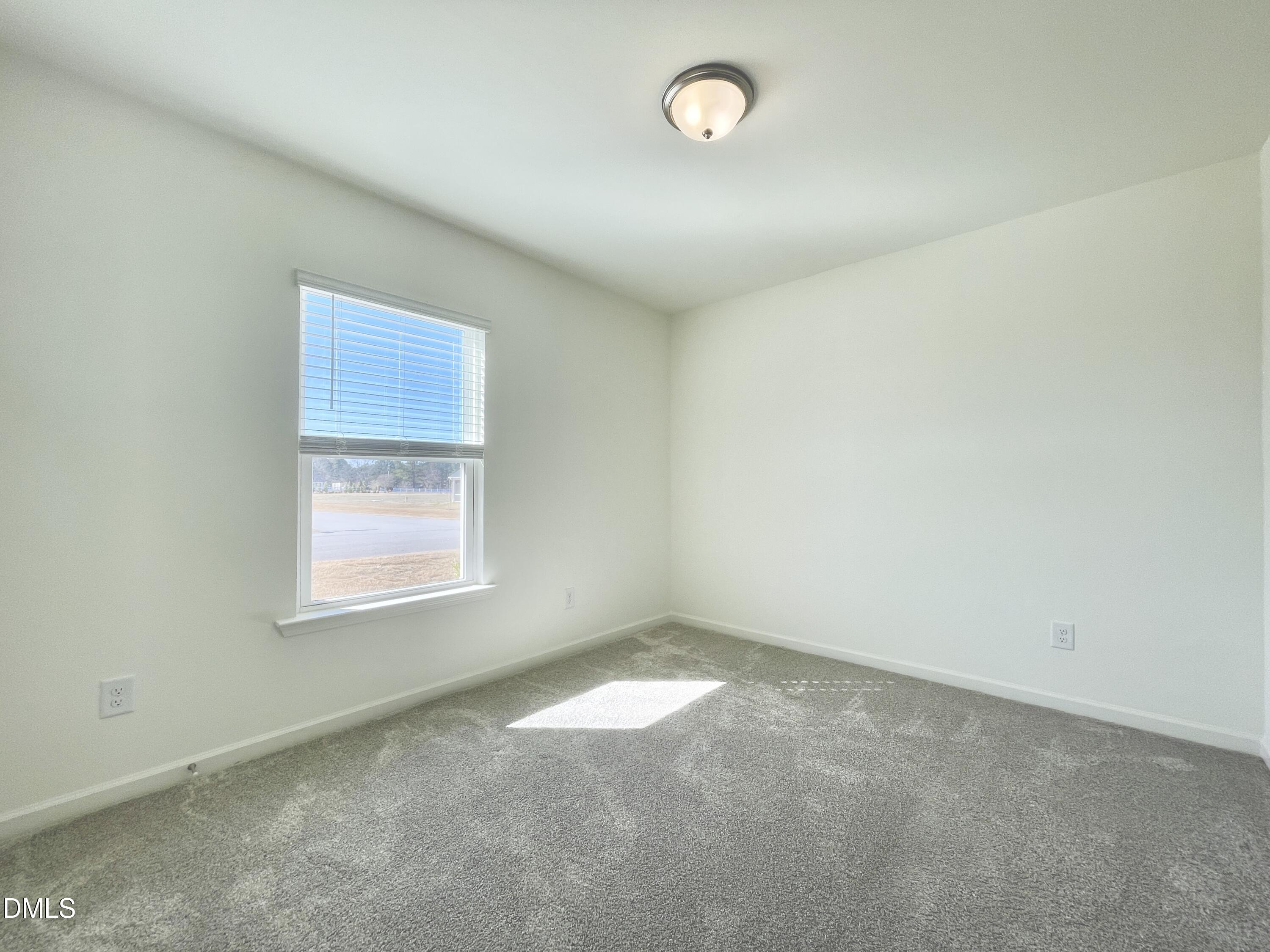 6117 Oak Psge Drive Raleigh, NC 27603 - Photo 21 of 25 an empty room with a window
