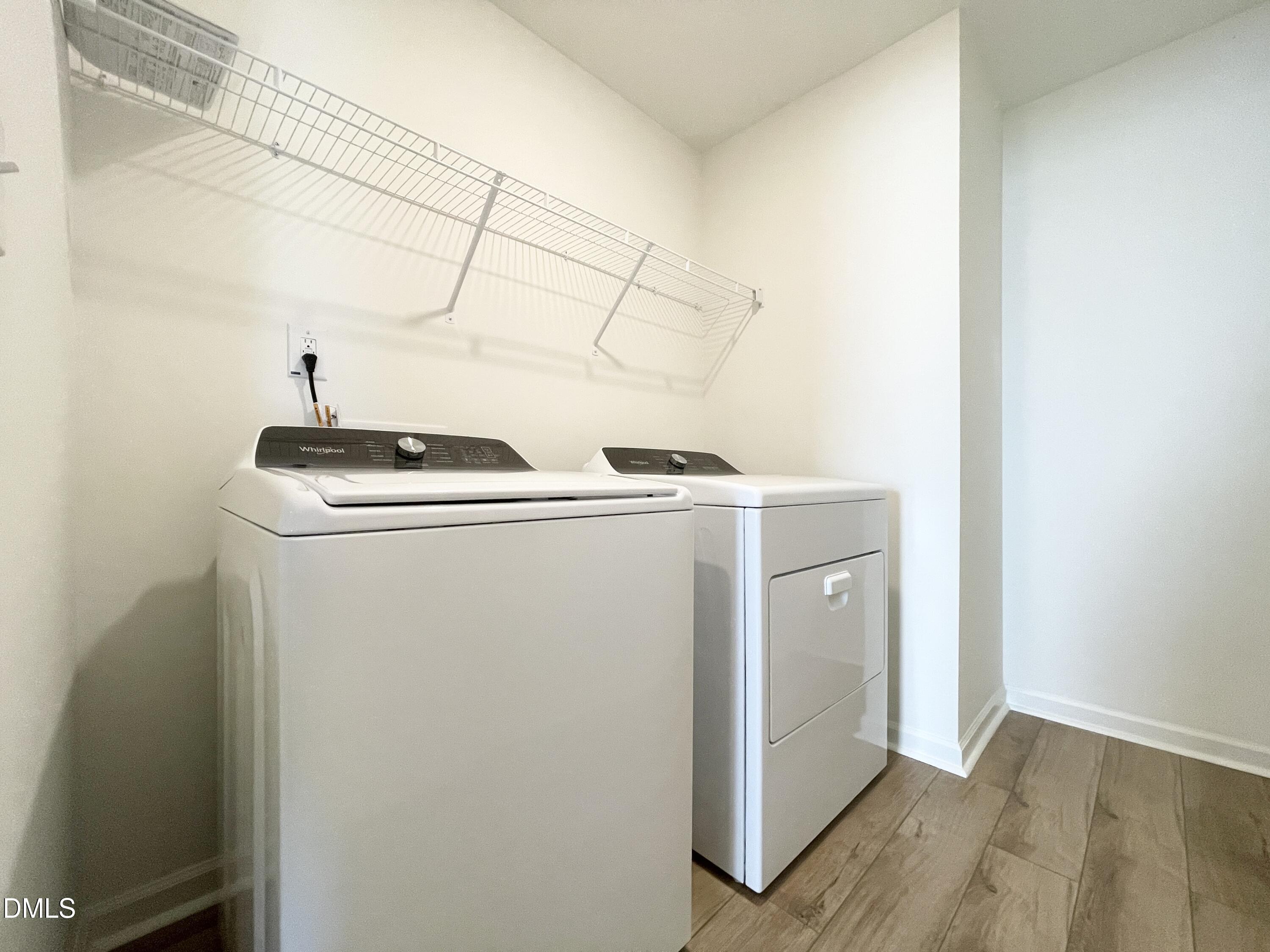 6117 Oak Psge Drive Raleigh, NC 27603 - Photo 23 of 25 a utility room with dryer and washer