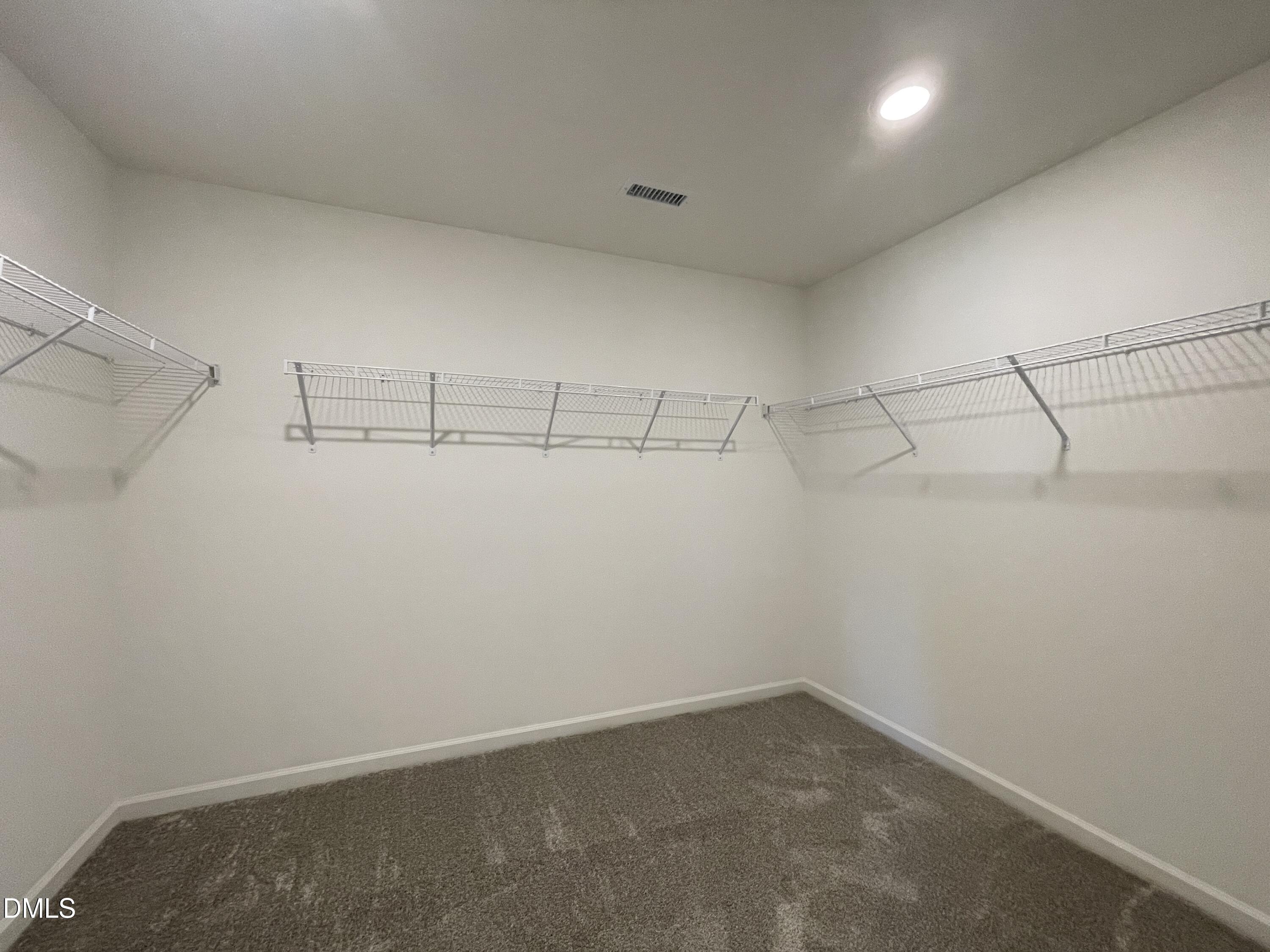 6117 Oak Psge Drive Raleigh, NC 27603 - Photo 24 of 25 a view of a room with racks on the wall