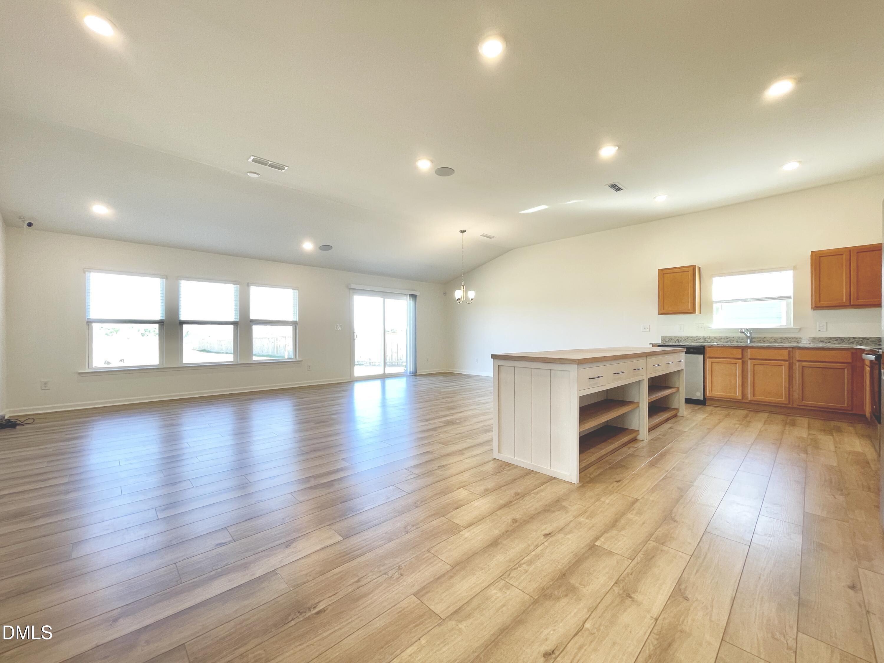 6117 Oak Psge Drive Raleigh, NC 27603 - Photo 3 of 25 a view of a kitchen with a sink and a large window