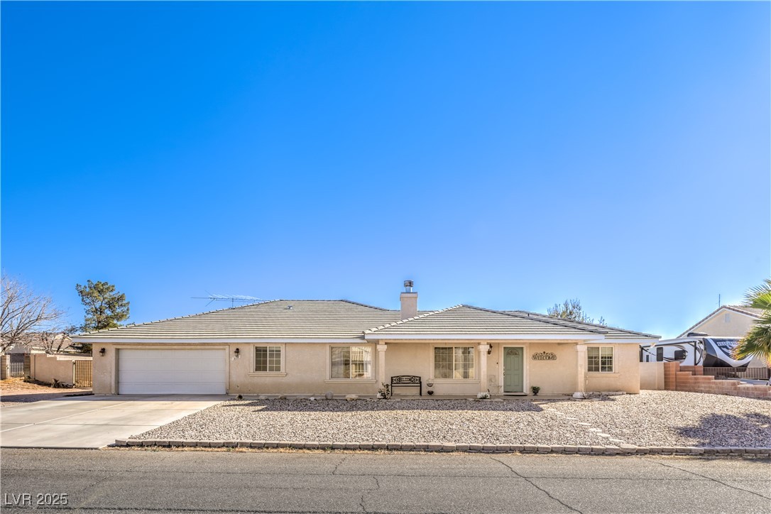 3192 North Taylor Street Logandale, NV 89021 - Photo 3 of 36 Single story home featuring a garage