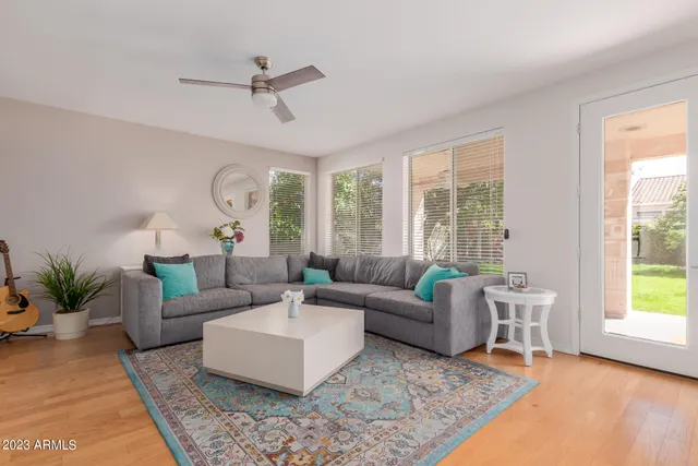 a living room with furniture and a large window