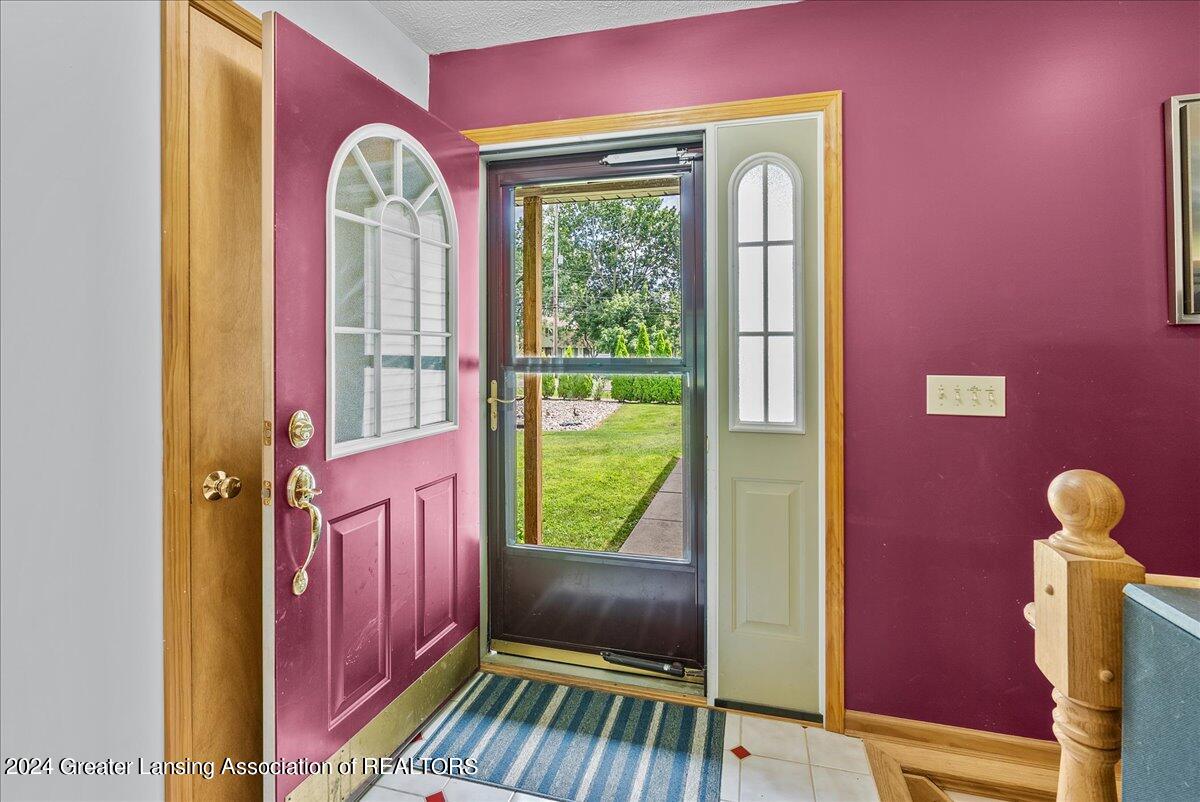 1645 North Aurelius Road Holt, MI 48842 - Photo 5 of 33 Front door entryway