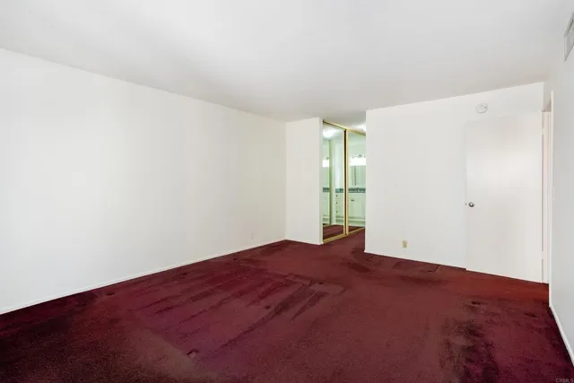 a view of a bathroom with a tub and mirror