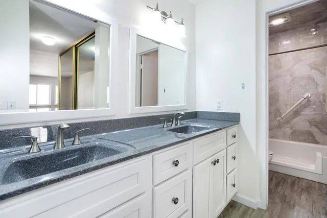 a bathroom with a bathtub and a shower