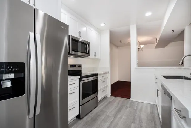 a kitchen with a sink and cabinets