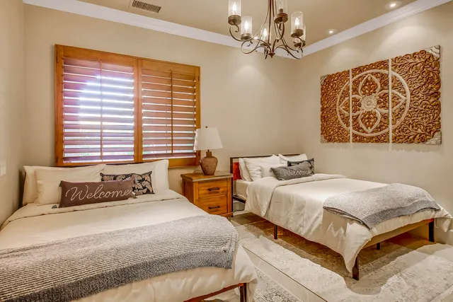 a view of a backyard with sitting area