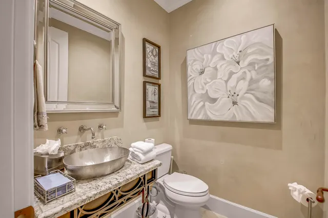 a dining room with furniture a chandelier and wooden floor
