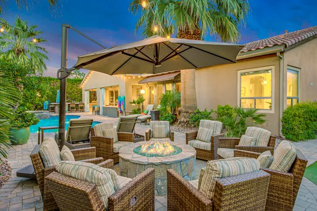 a view of a swimming pool with an outdoor space and seating area