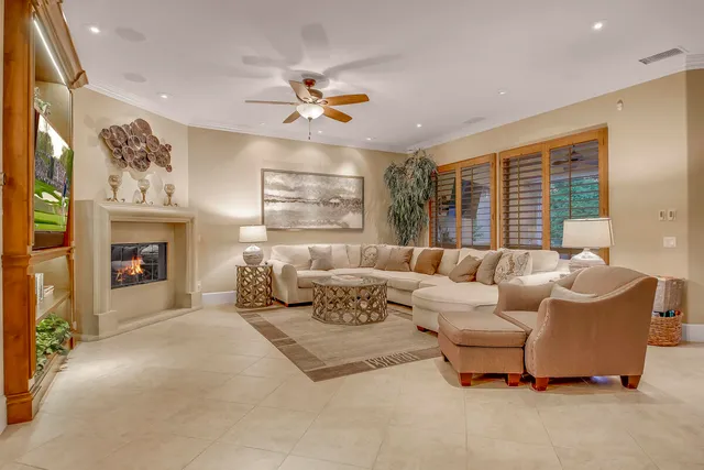 a dining room with furniture a large window and dining table