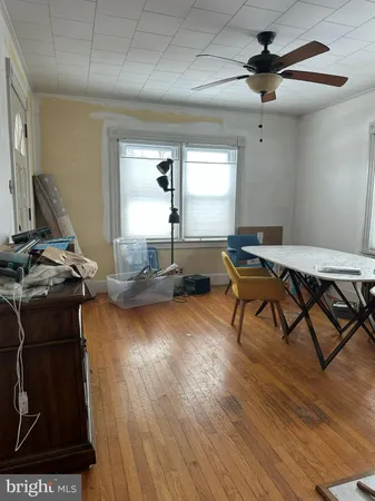 a workspace with furniture hardwood and a window