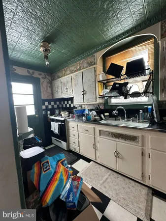 a kitchen with stainless steel appliances granite countertop a stove and cabinets