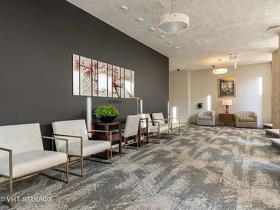 a view of a livingroom with furniture and window
