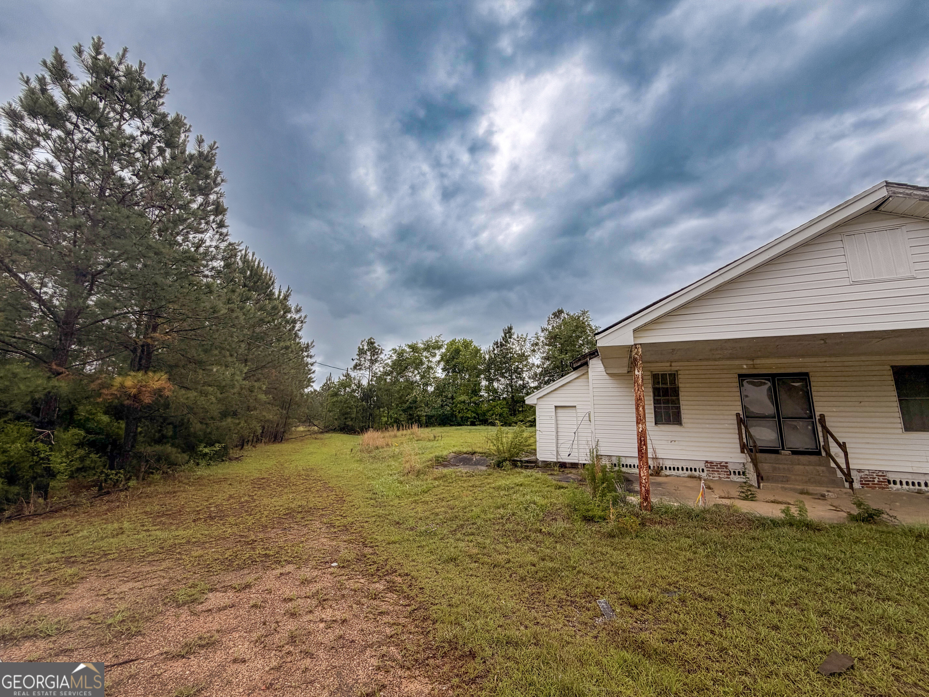 3925 Highway 441 Rentz, GA 31075 - Photo 15 of 16 a house view with a backyard space