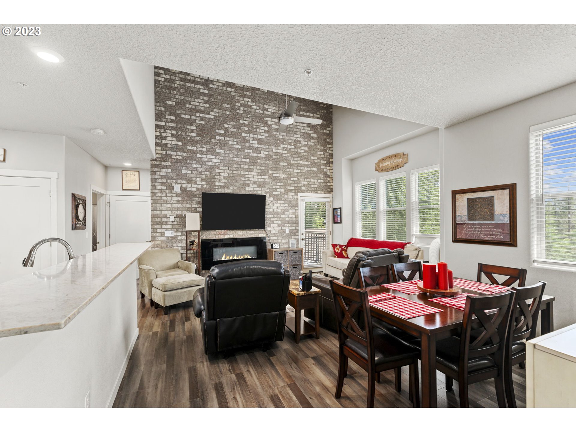 17051 Southwest Appledale Road, Unit 204 Beaverton, OR 97007 - Photo 11 of 23 a living room with furniture and a flat screen tv