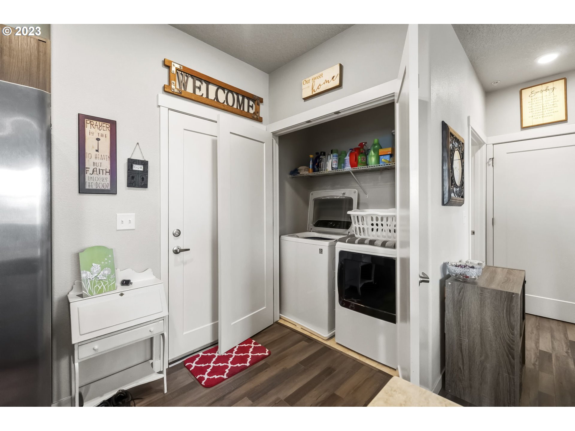 17051 Southwest Appledale Road, Unit 204 Beaverton, OR 97007 - Photo 19 of 23 a kitchen with stainless steel appliances kitchen island granite countertop a refrigerator and a stove