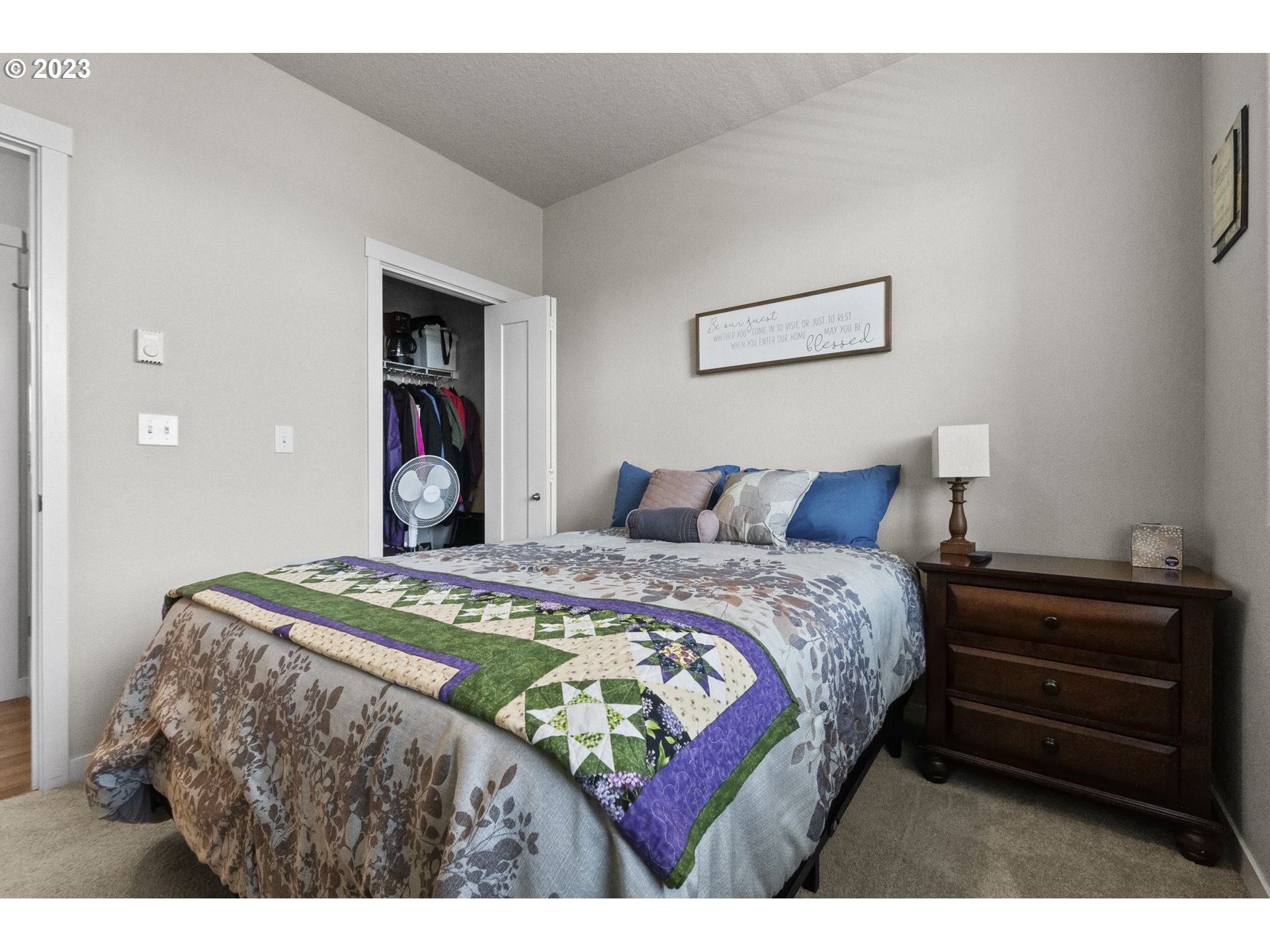 17051 Southwest Appledale Road, Unit 204 Beaverton, OR 97007 - Photo 5 of 23 a bedroom with a bed and a dresser