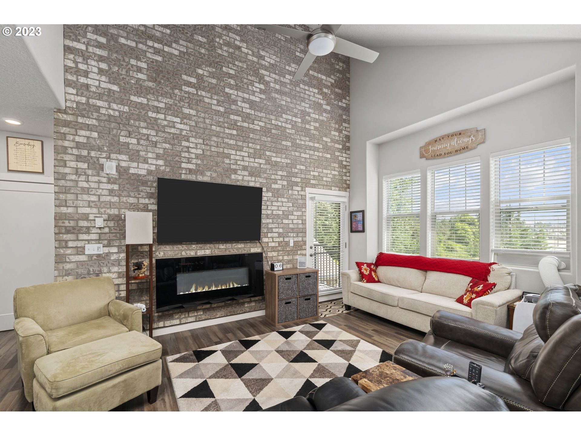 17051 Southwest Appledale Road, Unit 204 Beaverton, OR 97007 - Photo 10 of 23 a living room with furniture a rug and a fireplace