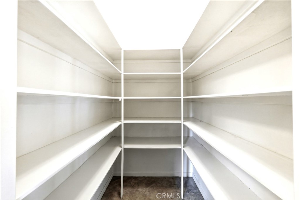 2145 Fairview Avenue Riverside, CA 92506 - Photo 14 of 35 a view of walk in closet with empty racks