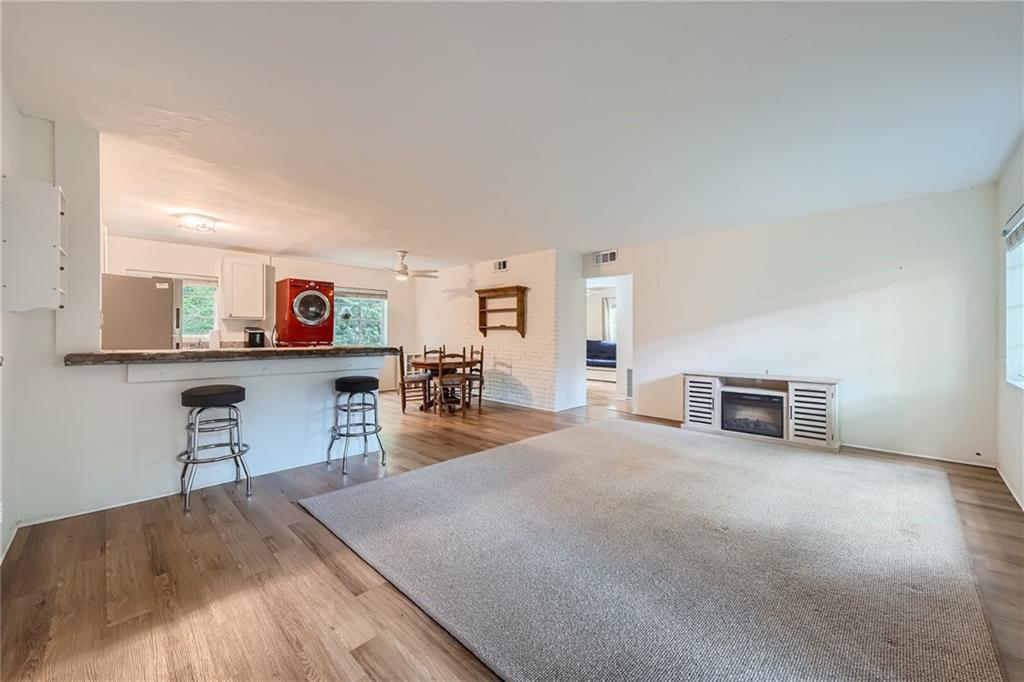 1381 Normandy Drive Northeast, Unit 2 Atlanta, GA 30306 - Photo 2 of 12 a view of a livingroom with furniture and a flat screen tv