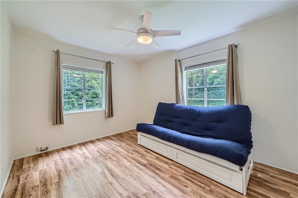 1381 Normandy Drive Northeast, Unit 2 Atlanta, GA 30306 - Photo 10 of 12 a living room with furniture and a window